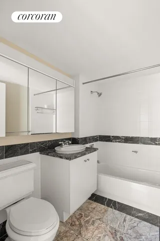 a bedroom with a large bed and a large window