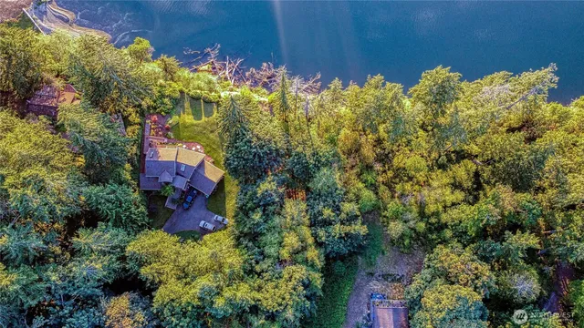 a view of a house with a flower garden