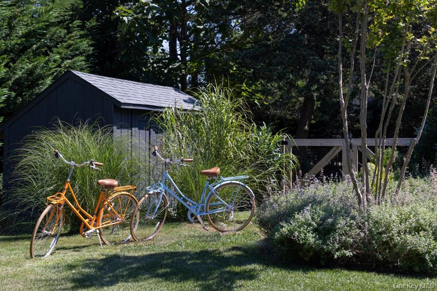 48 Middle Pond Road Southampton, NY 11968 - Photo 5 of 22 a view of a backyard with a table and plants