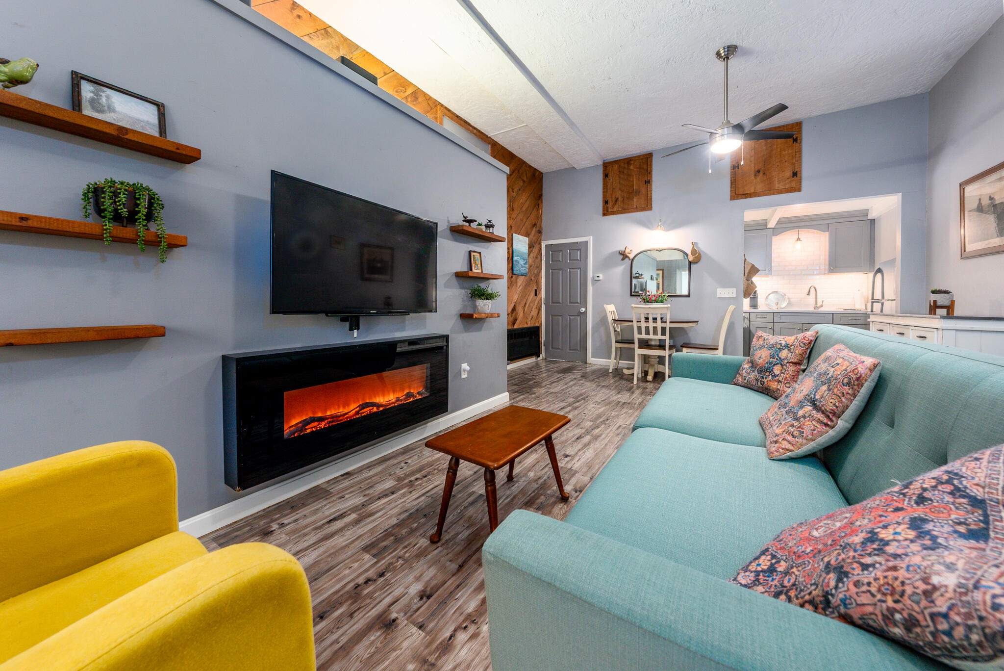 a living room with furniture and a flat screen tv