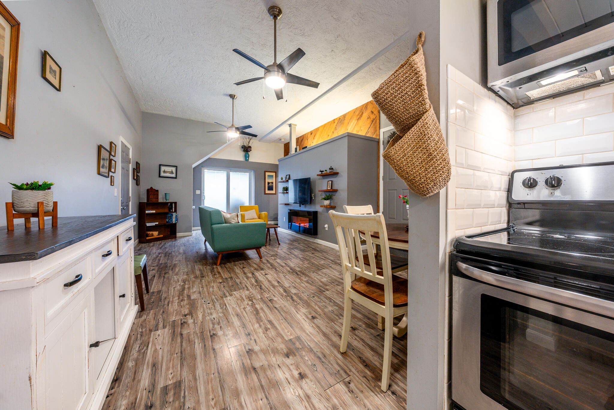 34 Erics Way, Unit G 7 Wellfleet, MA 02667 - Photo 11 of 24 a kitchen with stainless steel appliances granite countertop a stove and cabinets