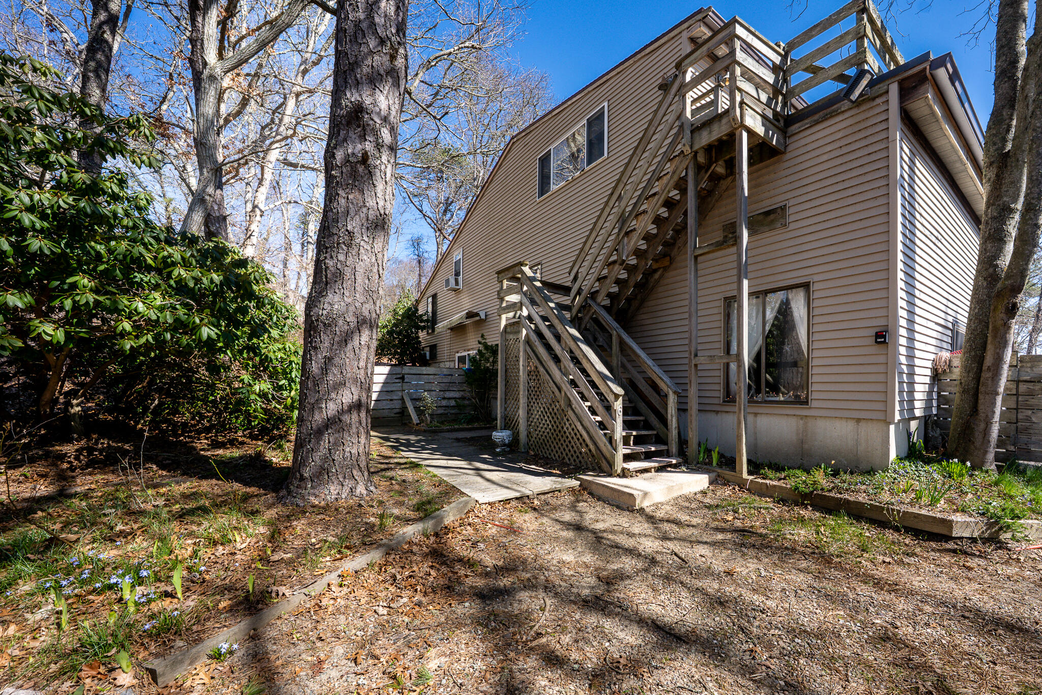 34 Erics Way, Unit G 7 Wellfleet, MA 02667 - Photo 17 of 24 a view of a house with a yard
