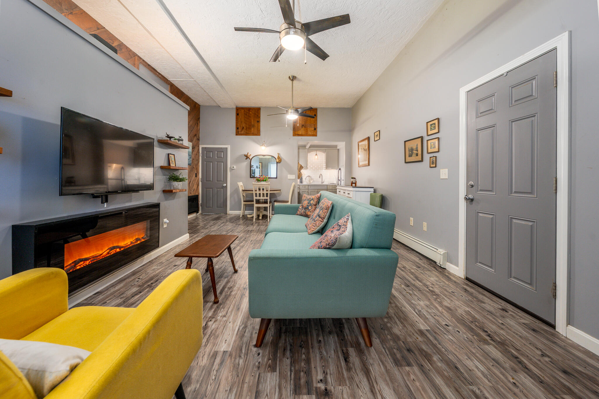 34 Erics Way, Unit G 7 Wellfleet, MA 02667 - Photo 2 of 24 a living room with furniture and a flat screen tv