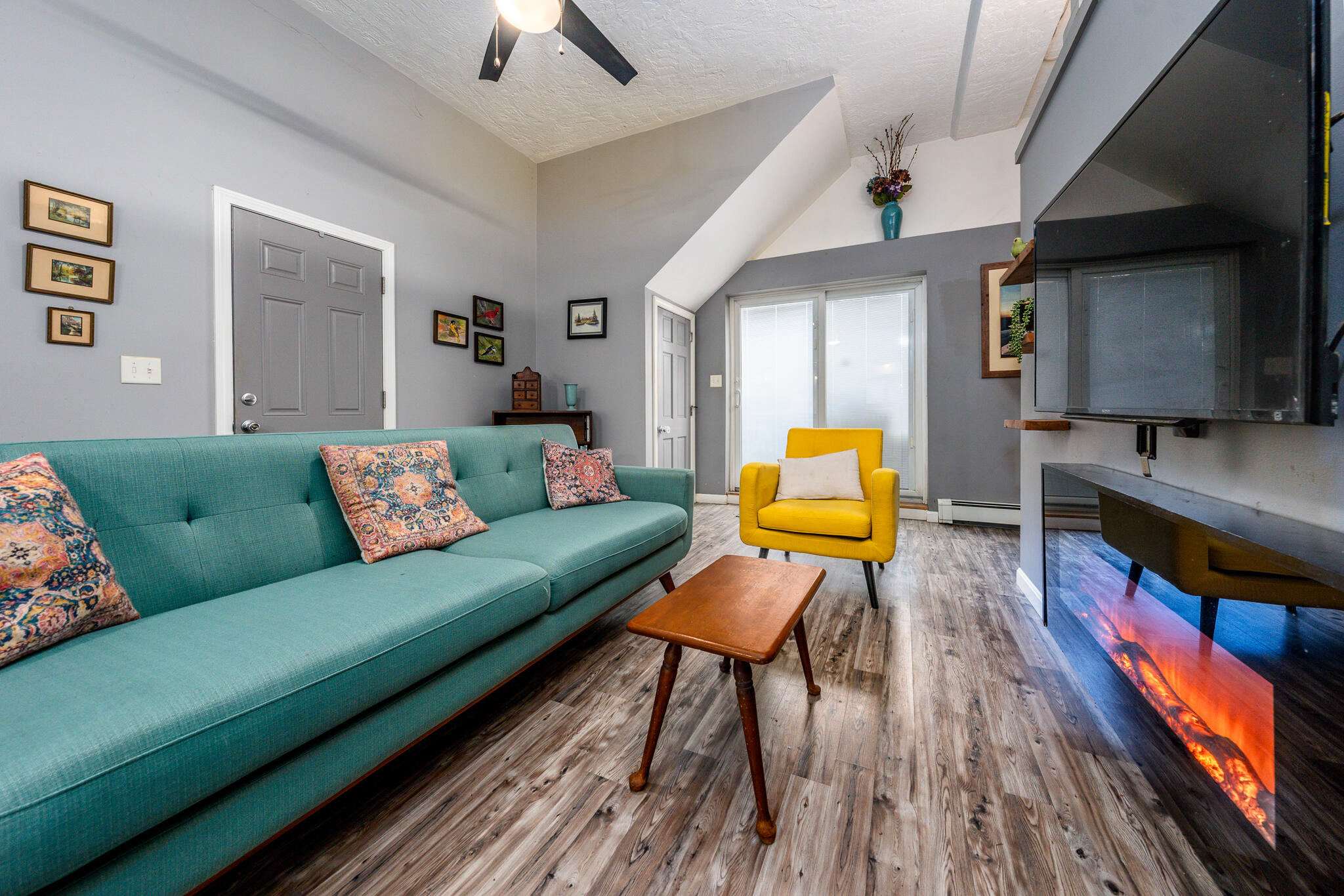 34 Erics Way, Unit G 7 Wellfleet, MA 02667 - Photo 3 of 24 a living room with furniture and a wooden floor
