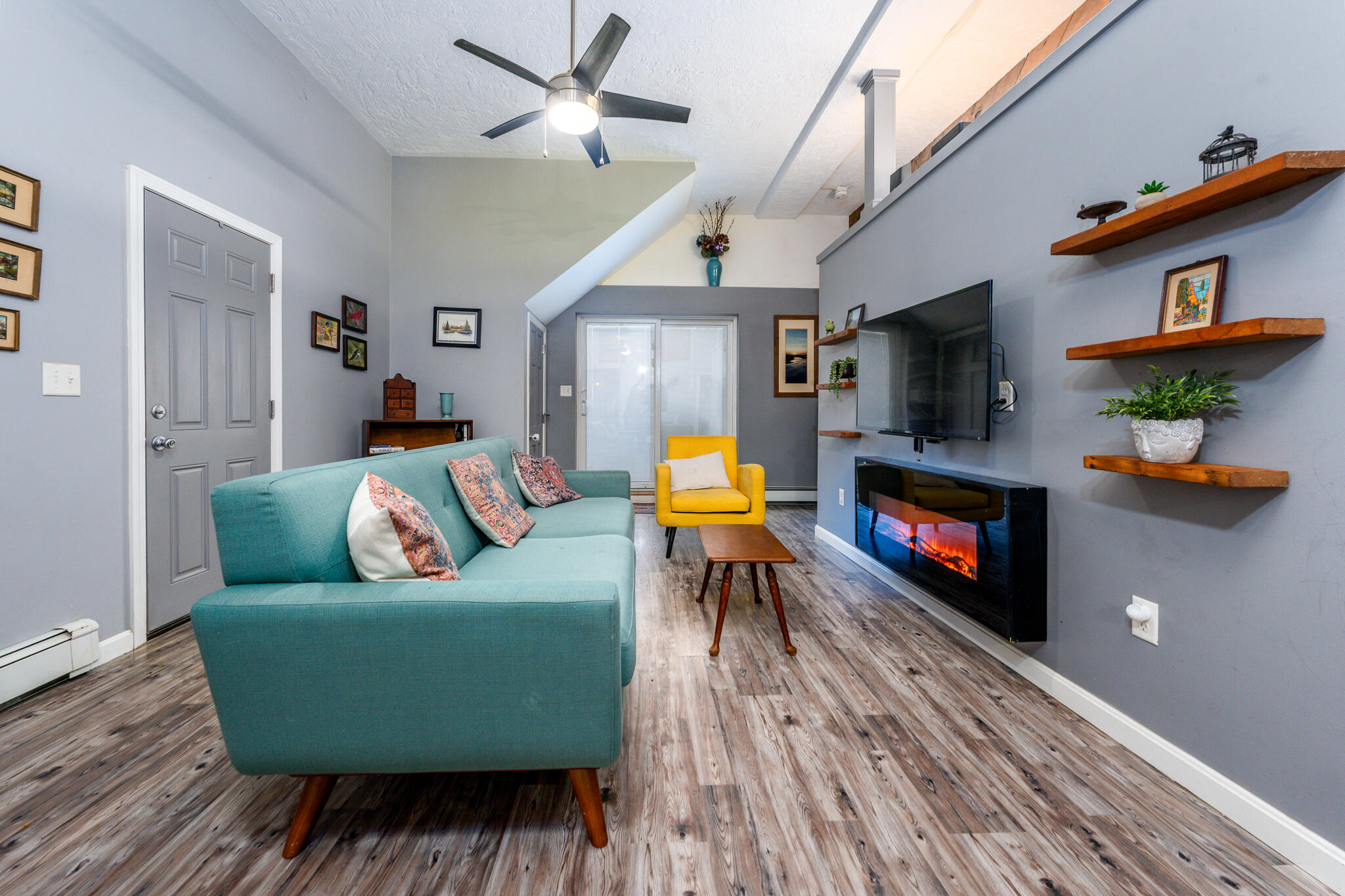 34 Erics Way, Unit G 7 Wellfleet, MA 02667 - Photo 4 of 24 a living room with furniture and a flat screen tv