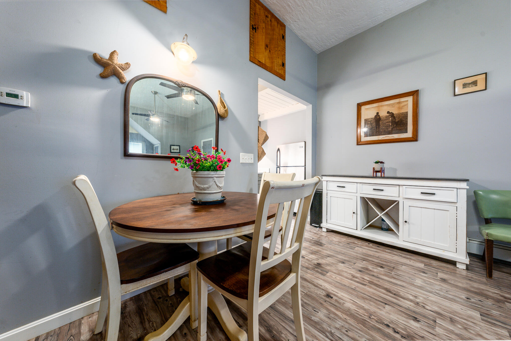34 Erics Way, Unit G 7 Wellfleet, MA 02667 - Photo 6 of 24 a view of a dining room with furniture and wooden floor
