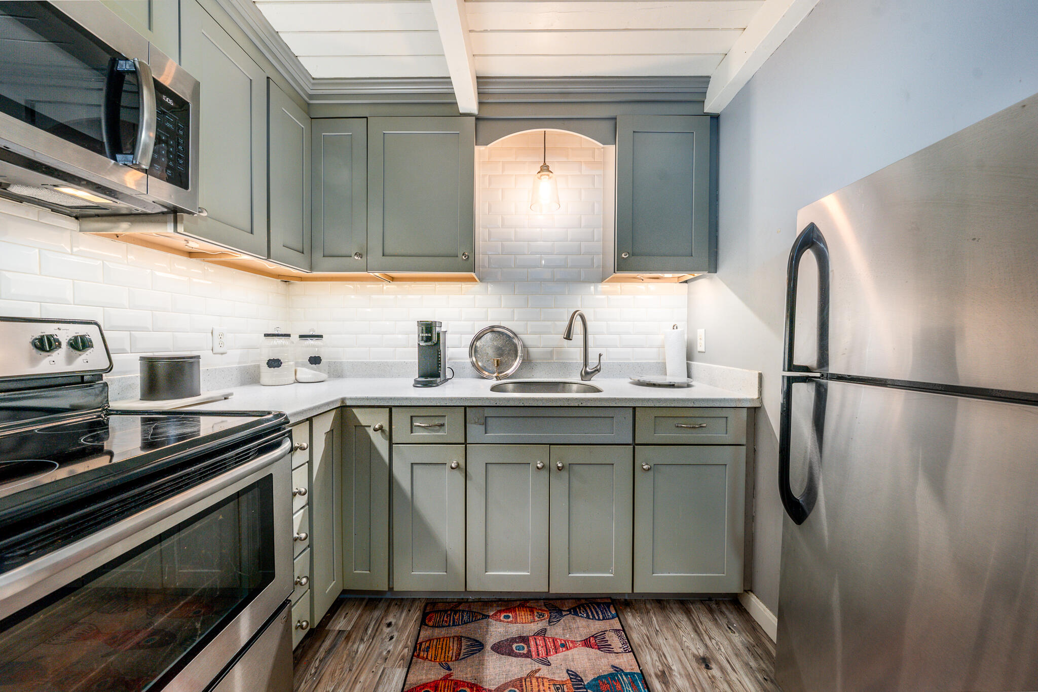 34 Erics Way, Unit G 7 Wellfleet, MA 02667 - Photo 7 of 24 a kitchen with stainless steel appliances a refrigerator and a sink