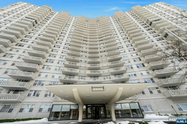 a view of a building with parking space