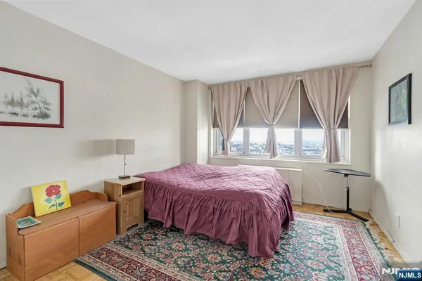 a bedroom with a bed and a view of bathroom