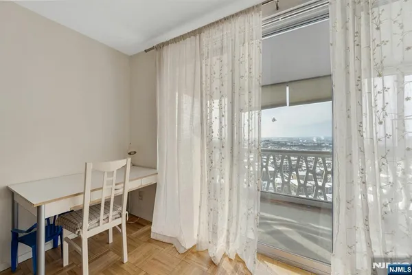 a dining room with furniture and window