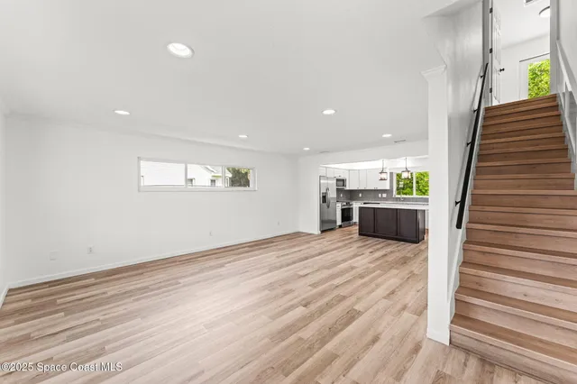 a view of an empty room and a window