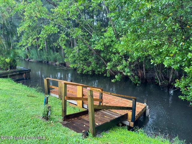 a wooden bench sitting in the middle of a lake