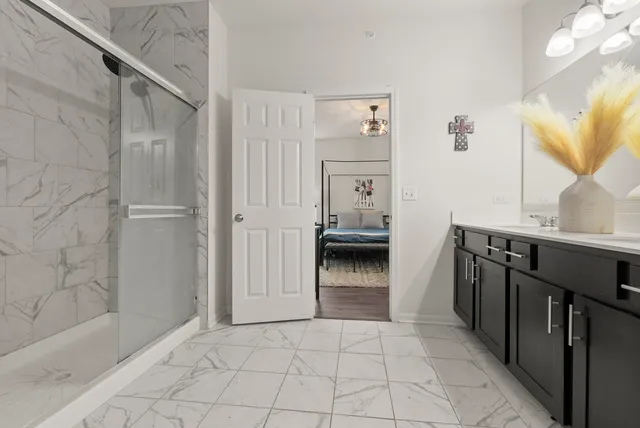 a view of a bathroom with a sink and a mirror