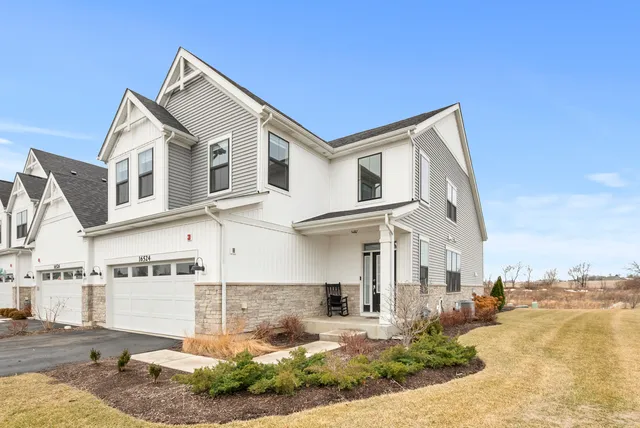 a front view of a house with a yard