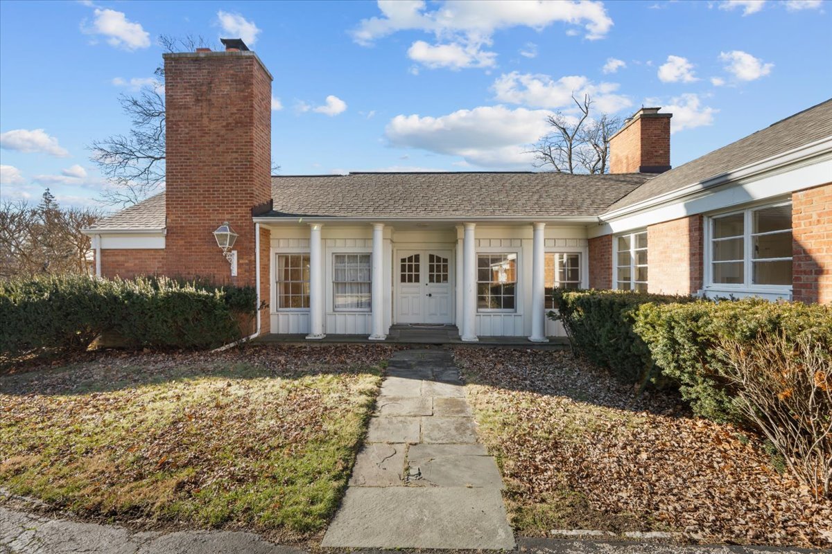 262 Foster Place Lake Forest, IL 60045 - Photo 3 of 27 a view of a brick house with a yard