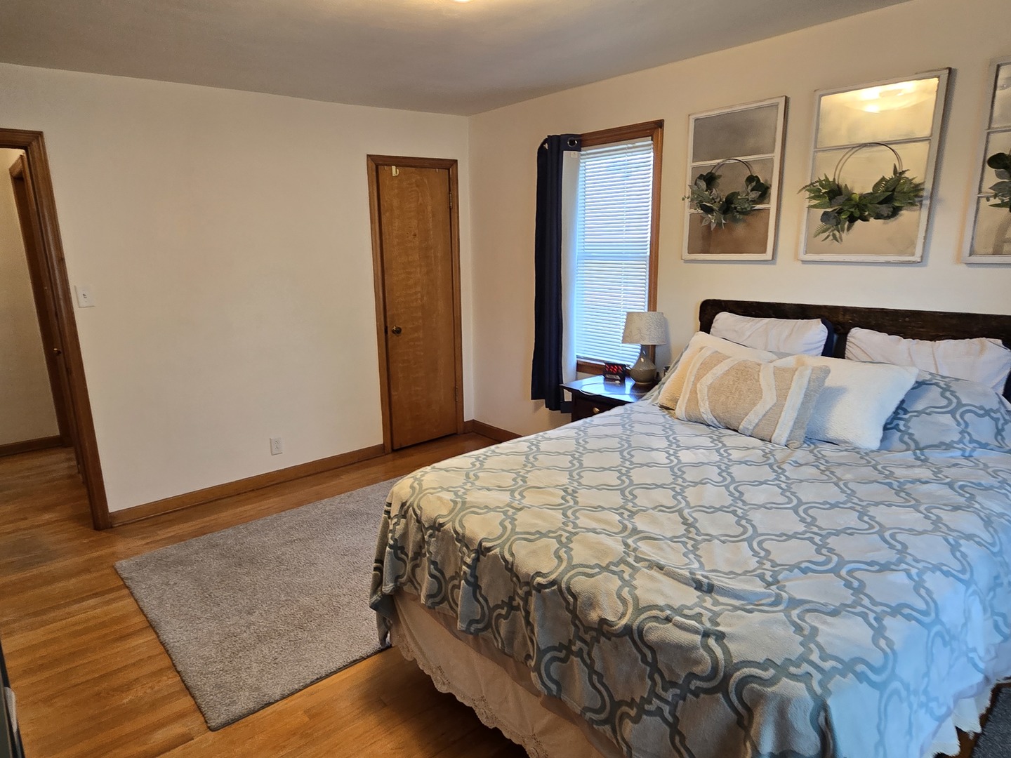 14558 Turner Avenue Midlothian, IL 60445 - Photo 7 of 20 a bedroom with a bed and painting on the wall