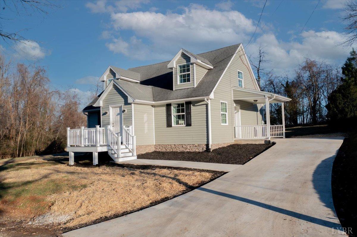 132 Spring Street Madison Heights, VA 24572 - Photo 1 of 63 a front view of a house with a yard