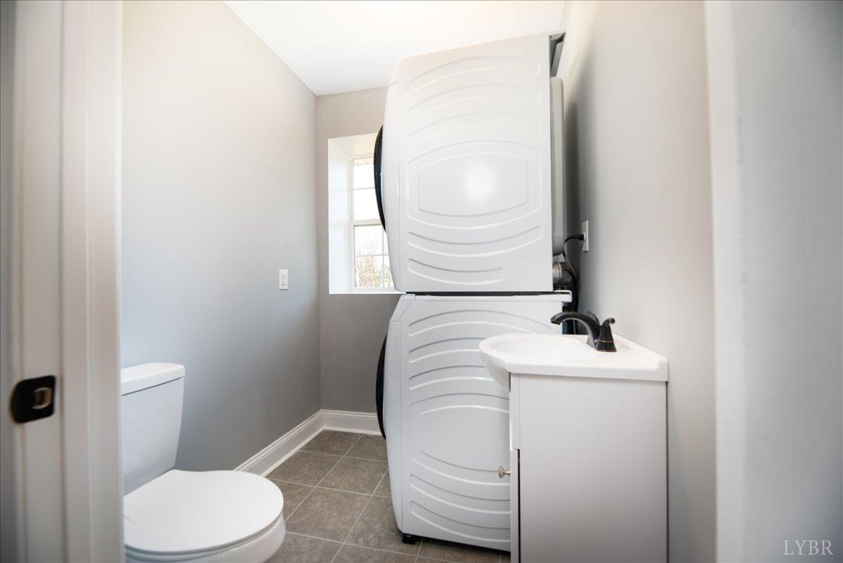 132 Spring Street Madison Heights, VA 24572 - Photo 27 of 63 a bathroom with a sink toilet and mirror