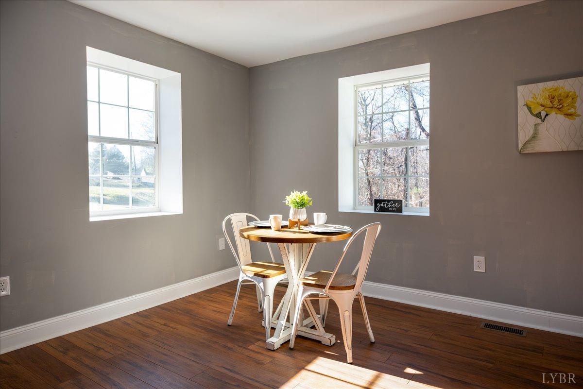 132 Spring Street Madison Heights, VA 24572 - Photo 3 of 63 a view of a dining room with furniture window and wooden floor