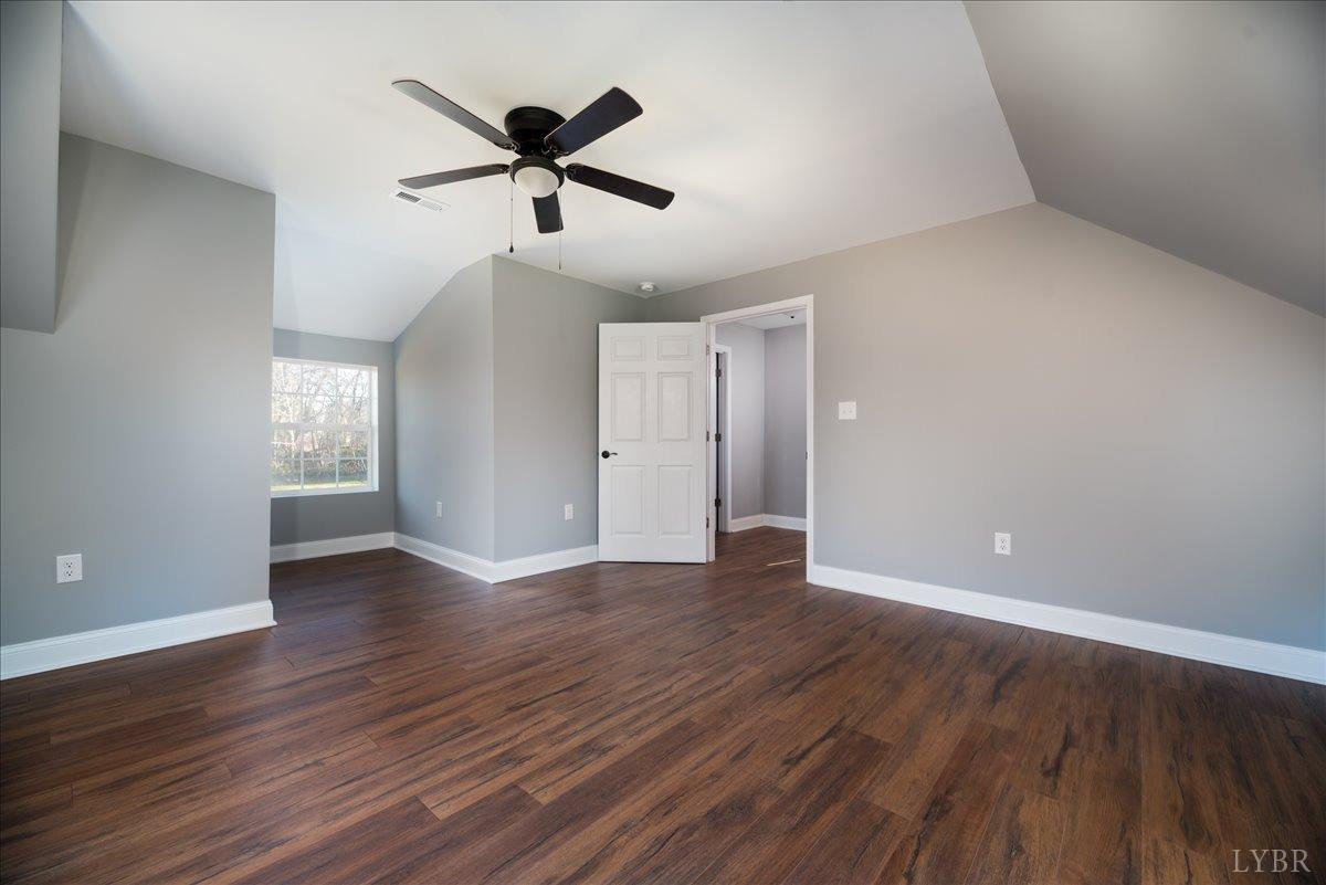 132 Spring Street Madison Heights, VA 24572 - Photo 31 of 63 a view of an empty room with wooden floor and a window