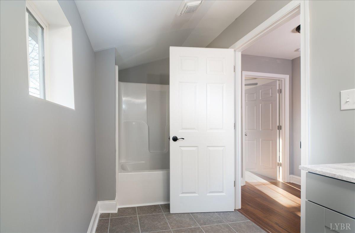 132 Spring Street Madison Heights, VA 24572 - Photo 33 of 63 a bathroom with a tub shower and sink