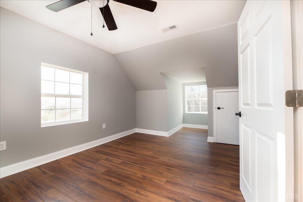 132 Spring Street Madison Heights, VA 24572 - Photo 34 of 63 an empty room with wooden floor and windows