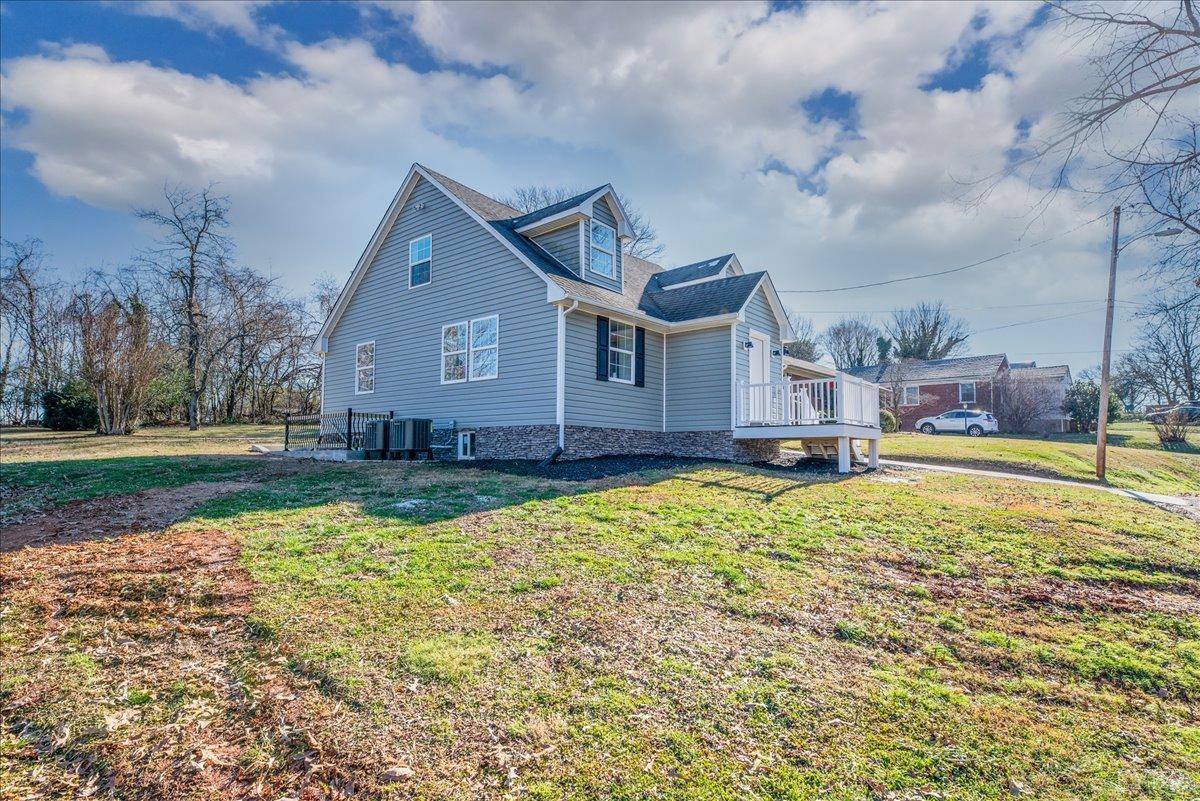 132 Spring Street Madison Heights, VA 24572 - Photo 52 of 63 a view of a house with swimming pool and a yard