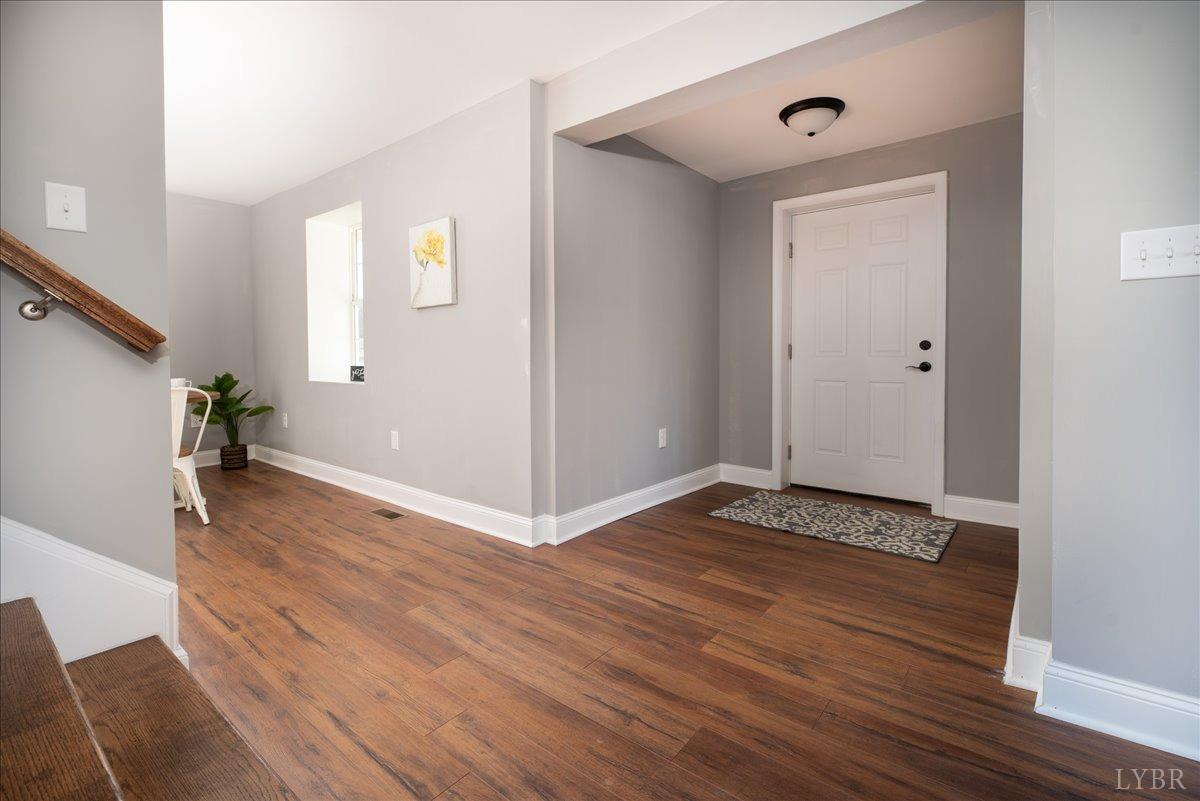 132 Spring Street Madison Heights, VA 24572 - Photo 6 of 63 a view of an empty room and wooden floor