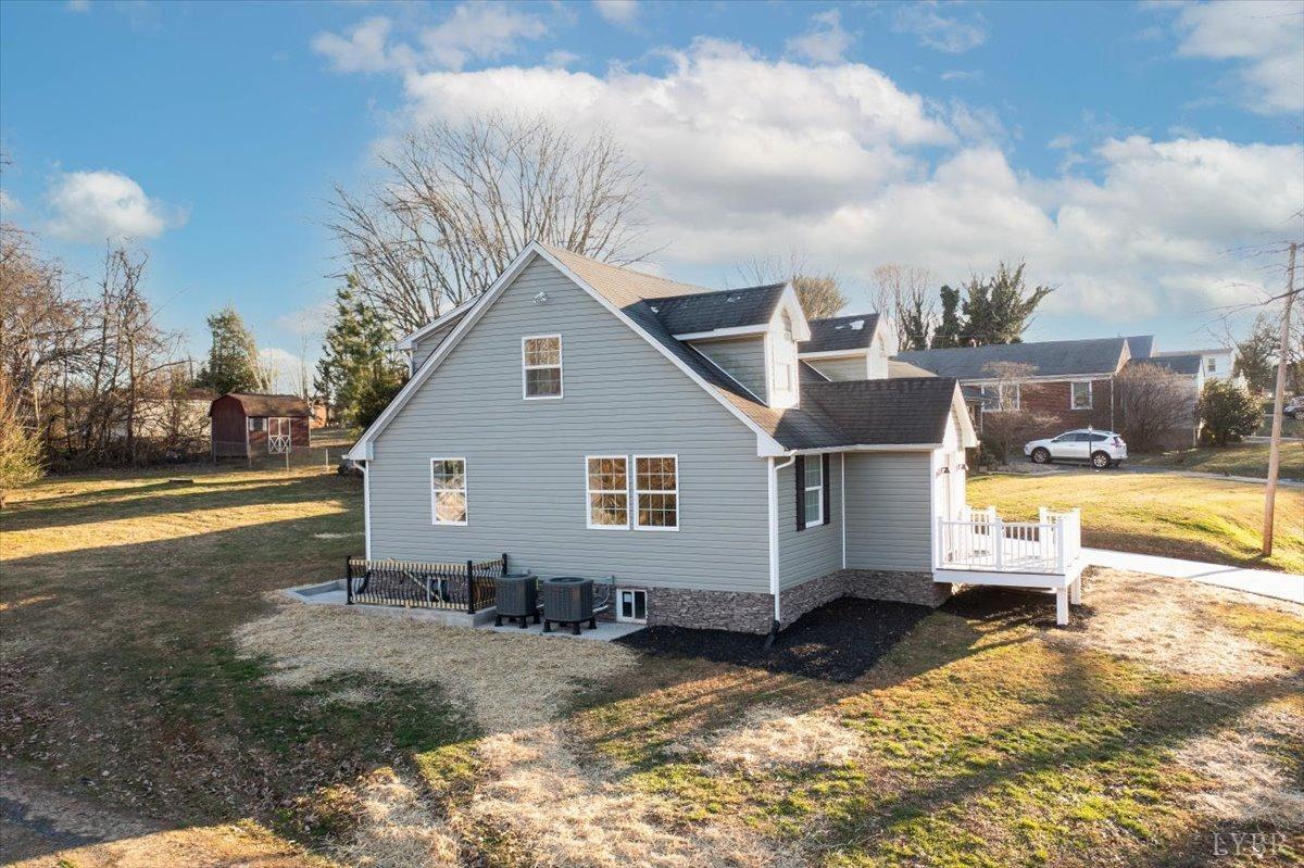 132 Spring Street Madison Heights, VA 24572 - Photo 61 of 63 a view of a house with backyard and sitting area
