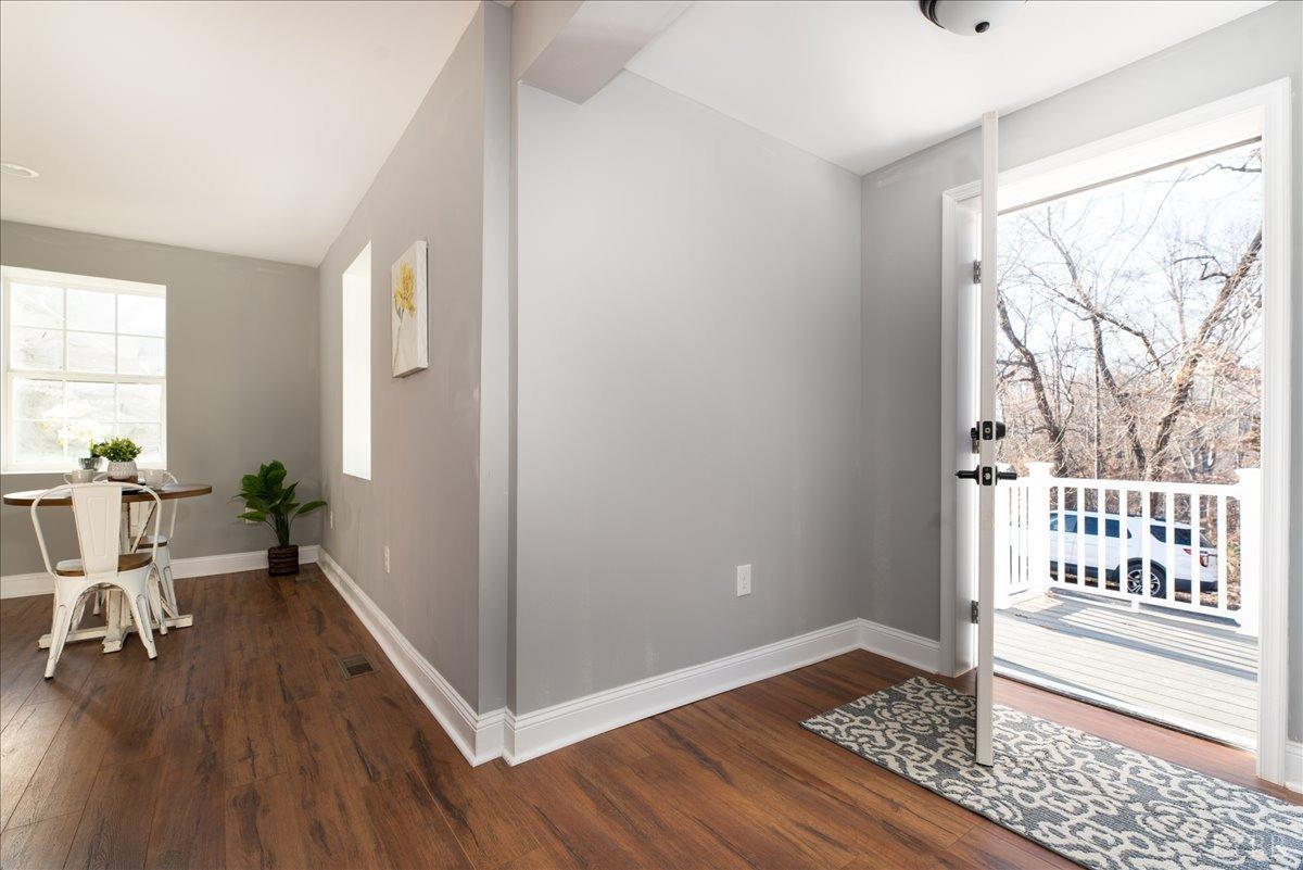 132 Spring Street Madison Heights, VA 24572 - Photo 7 of 63 a view of an empty room with wooden floor and a window