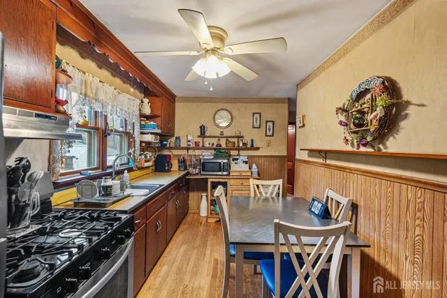a kitchen with a table and chairs