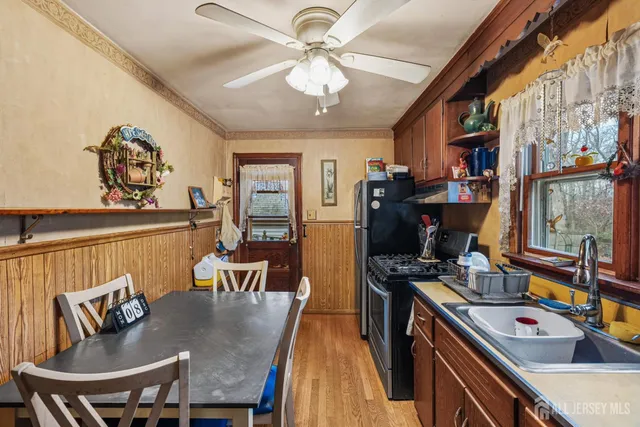 a view of a dining room with furniture and a chandelier