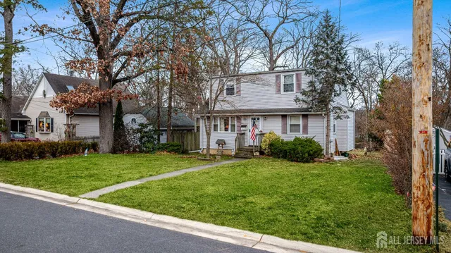 a view of a house with a yard and plants