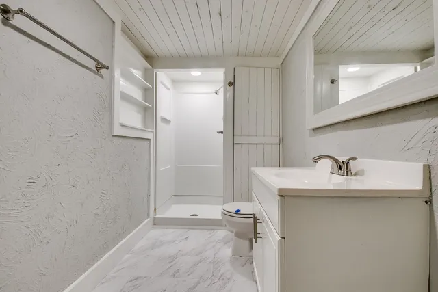 a bathroom with a sink and mirror