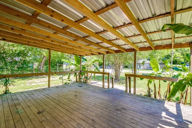 a house with wooden floor and outdoor space