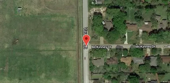 a bathroom with a shower and trees