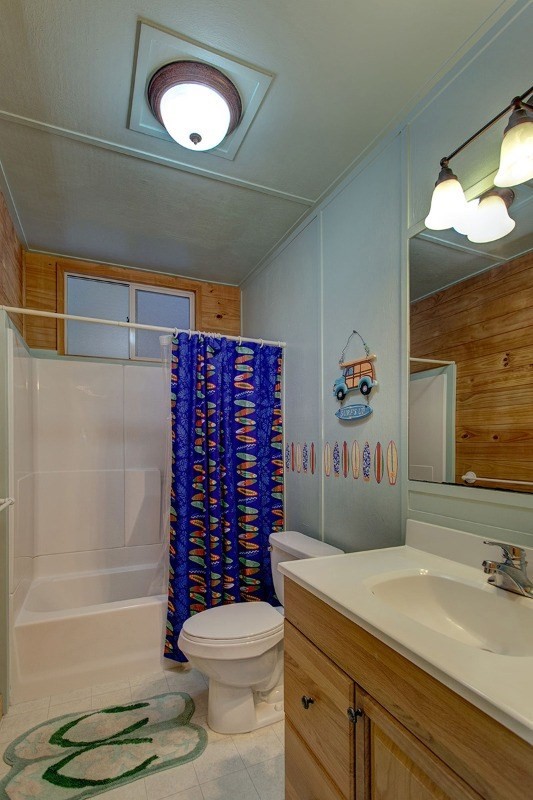 99-7721 Kilau Place Volcano, HI 96785 - Photo 18 of 26 a bathroom with a sink a toilet and shower