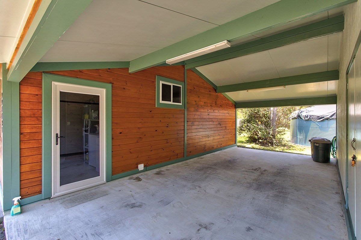 99-7721 Kilau Place Volcano, HI 96785 - Photo 20 of 26 a view of a house with an empty space and balcony