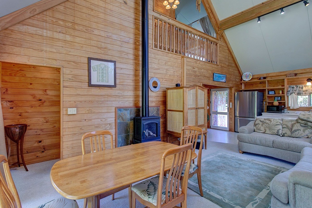 99-7721 Kilau Place Volcano, HI 96785 - Photo 2 of 26 a view of a dining room with furniture