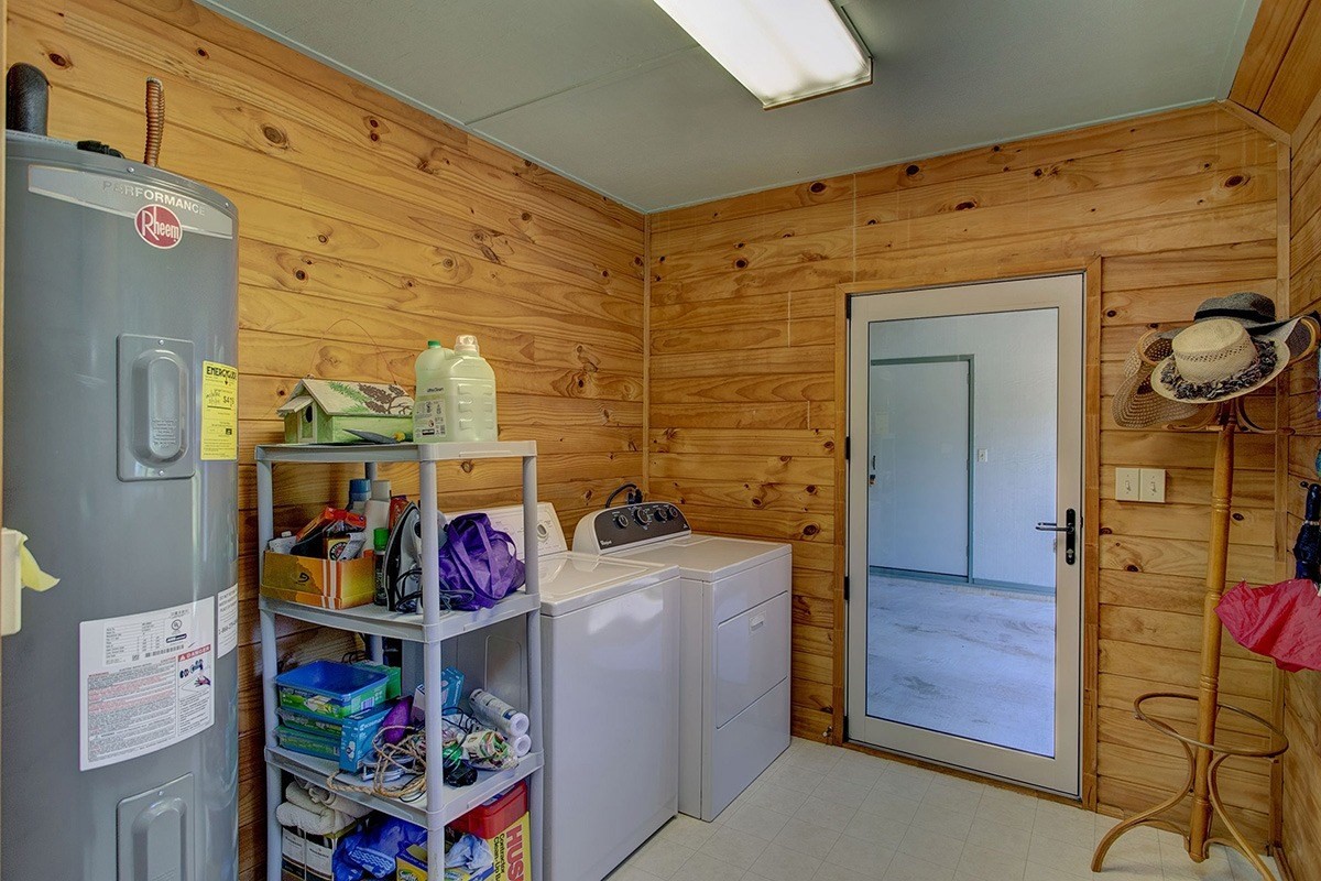 99-7721 Kilau Place Volcano, HI 96785 - Photo 21 of 26 a utility room with dryer and washer