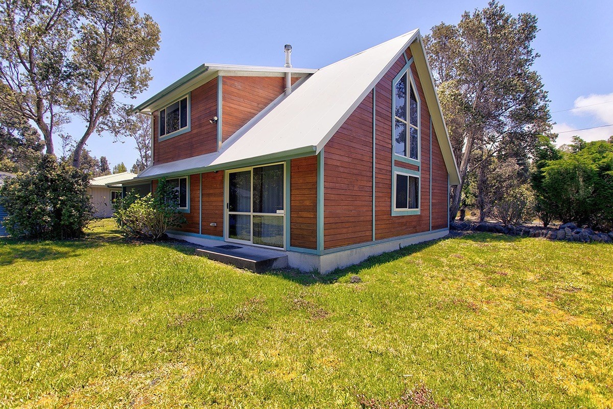 99-7721 Kilau Place Volcano, HI 96785 - Photo 23 of 26 a view of a house with pool and a yard