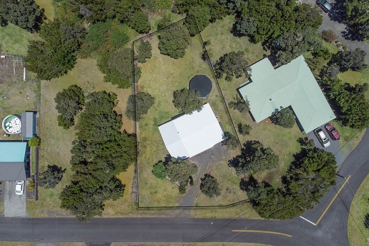 99-7721 Kilau Place Volcano, HI 96785 - Photo 26 of 26 an aerial view of a house with a yard and parking space