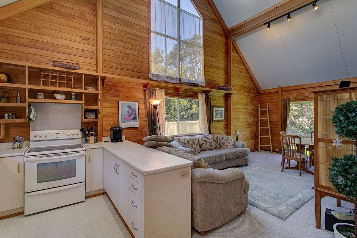 99-7721 Kilau Place Volcano, HI 96785 - Photo 3 of 26 a kitchen that has a sink and a stove