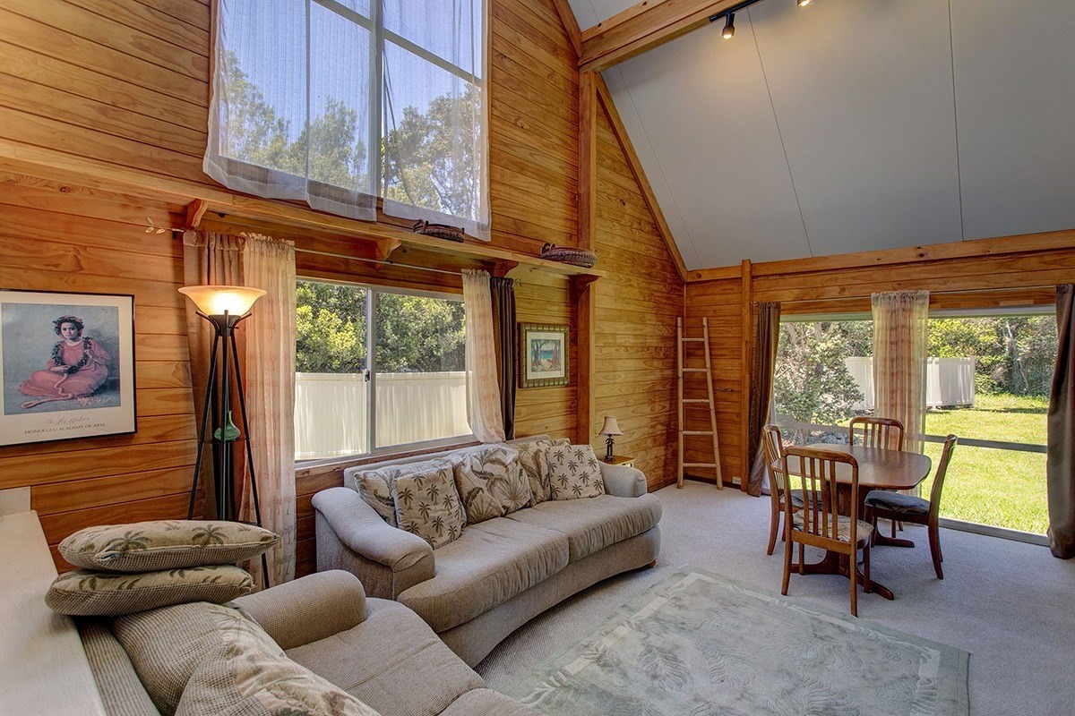 99-7721 Kilau Place Volcano, HI 96785 - Photo 6 of 26 a living room with furniture and a large window