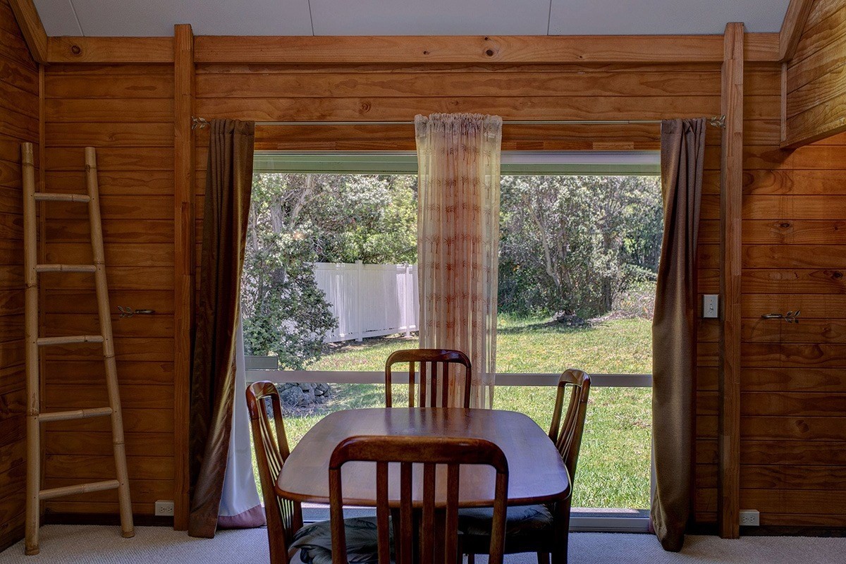 99-7721 Kilau Place Volcano, HI 96785 - Photo 7 of 26 a view of a dining room with furniture window and outside view