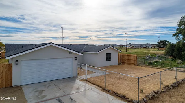 a house view with a garden space