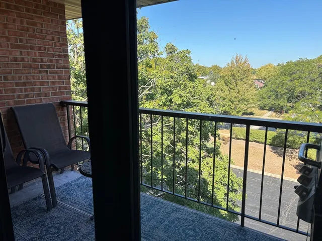 a view of balcony with furniture
