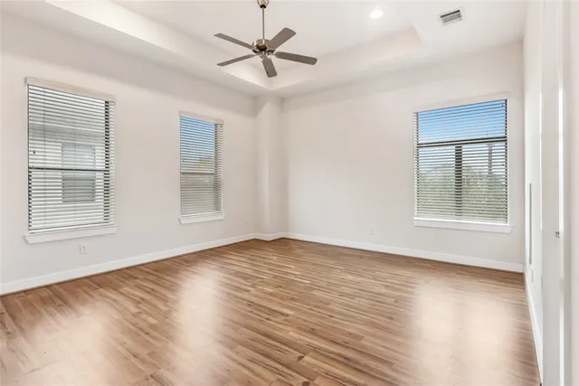 a view of a room with wooden floor