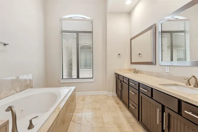 a bathroom with a bathtub and a sink