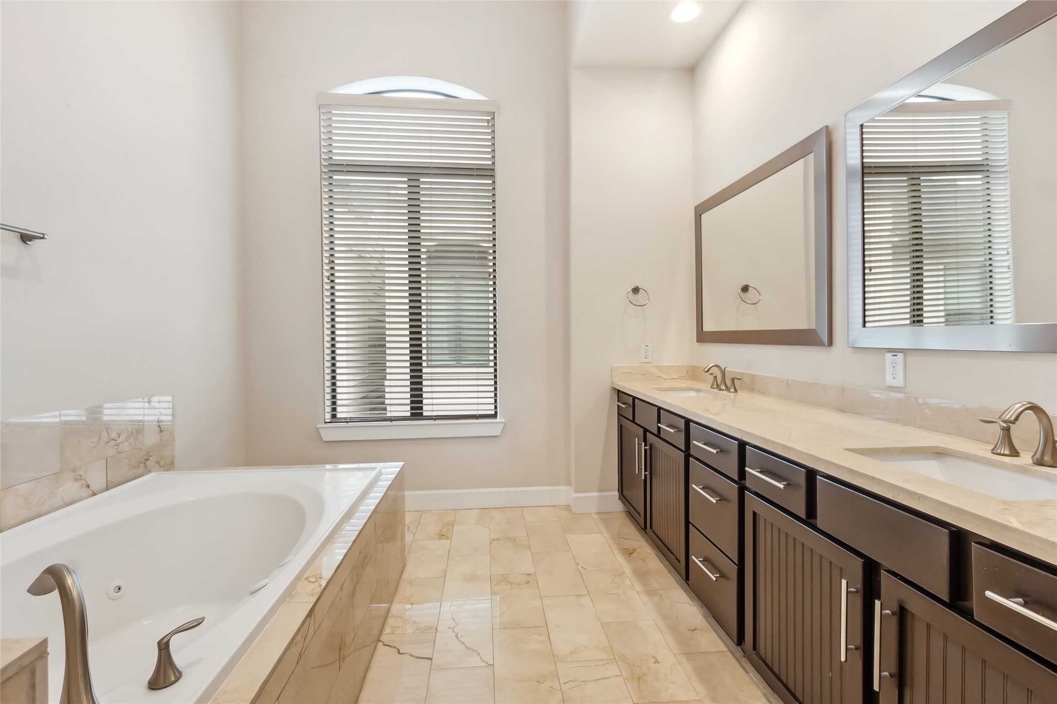 5729 Larkin Street, Unit A Houston, TX 77007 - Photo 13 of 23 a bathroom with a granite countertop tub sink and mirror